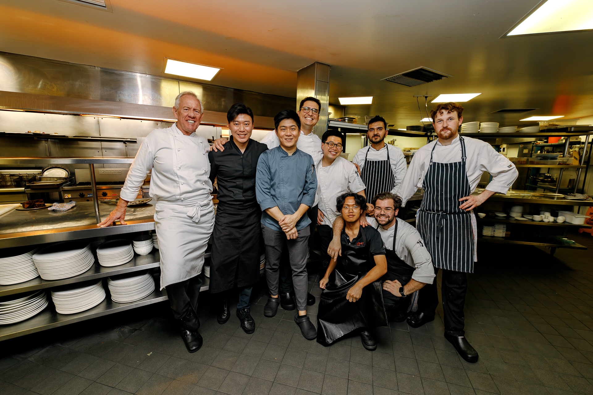 Group image of chefs in the Fraser's Restaurant kitchen at the Four Hands Dinner