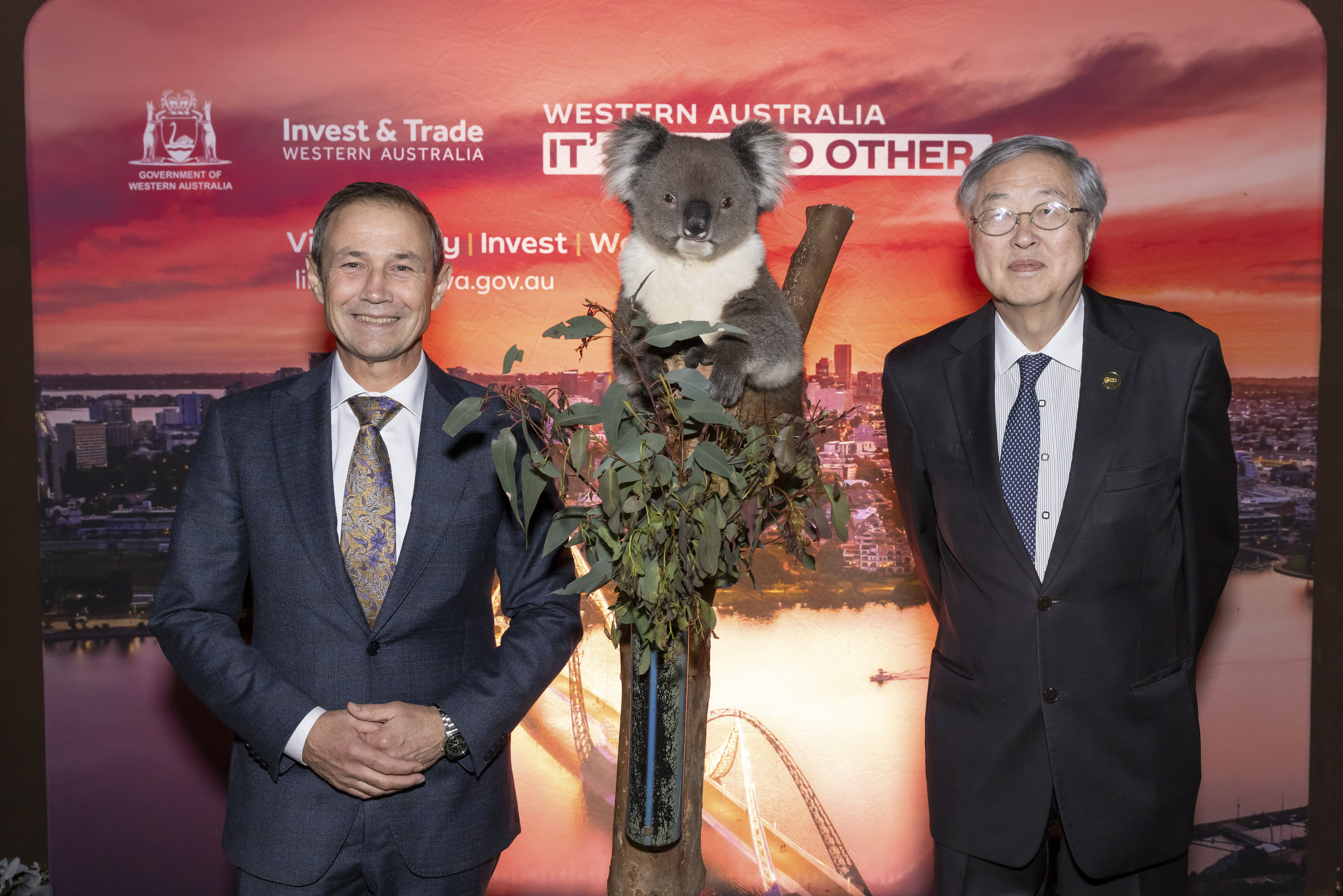 Premier Cook and H.E. Zhou Xiaochuan, Vice Chairman of BFA standing next to a Koala