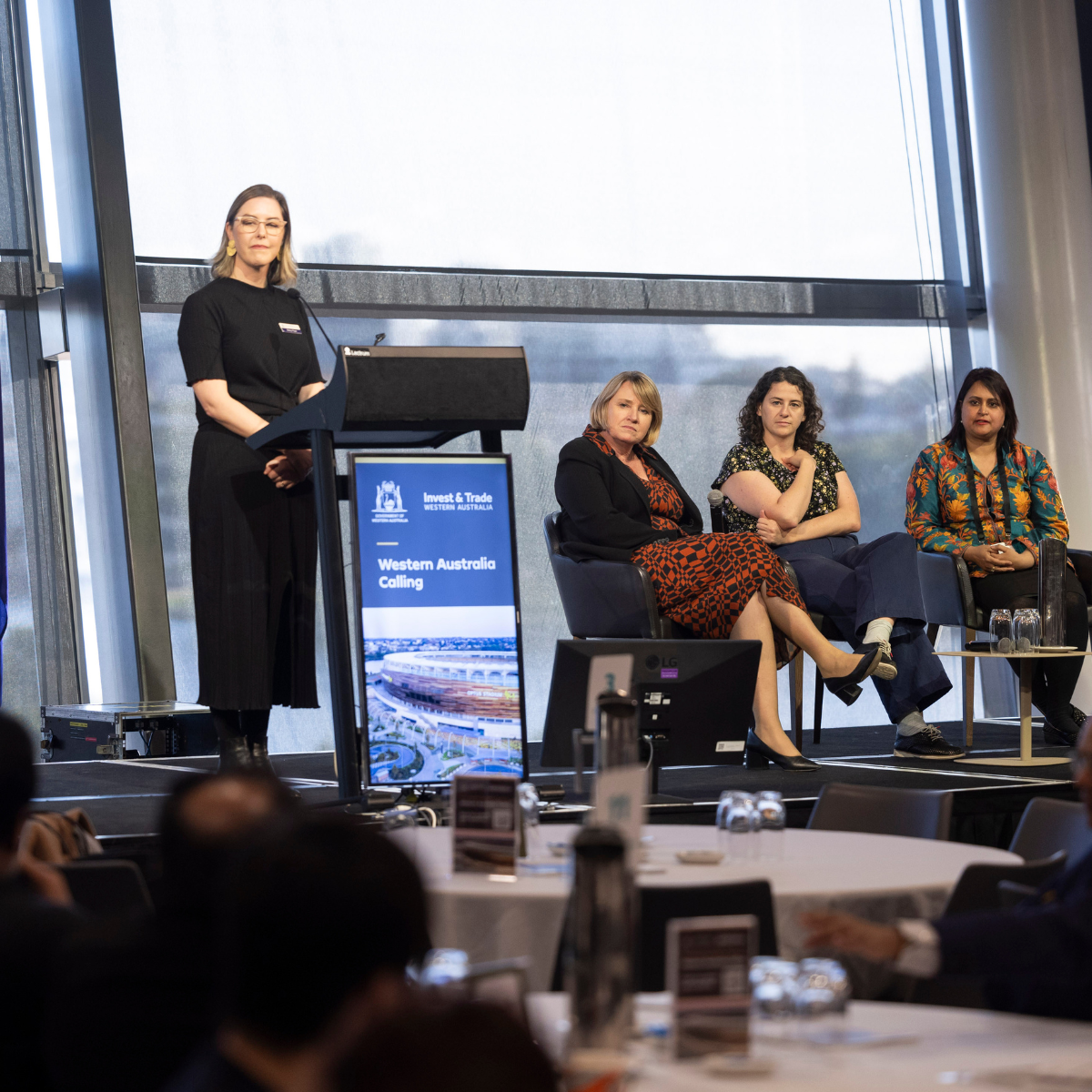 Daisy Pope speaking at the WA Calling session at the Australian Indian Chamber of Commerce (AICC) National Conference. Also on the stage are Director General Rebecca Brown and WA Invest and Trade Commissioner for the India Gulf Region Nashid Chowdhury 
